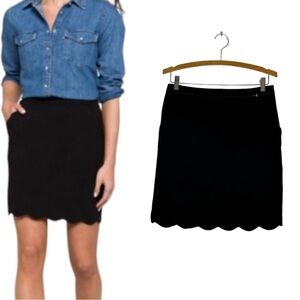 Skies are blue Med scalloped hem black skirt.Can be styled for work or leisure.